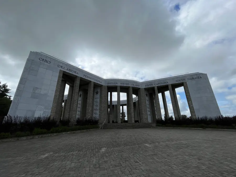 The star-shaped Mardasson Memorial in Bastogne, partly screened by renovation hoarding.